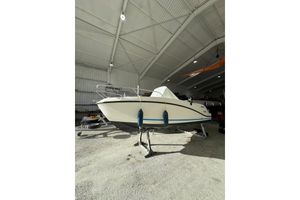 Quicksilver Activ 555 Open 2011 Quicksilver Activ 555 Open boat in a spacious indoor storage facility.