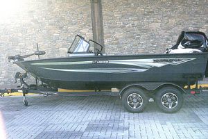Ranger VX1888 WT 2026 Ranger VX1888 WT boat on trailer, parked against stone wall.