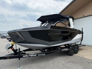 Nautique Super Air Nautique G23 2025 Nautique Super Air Nautique G23 boat on trailer, parked outdoors.