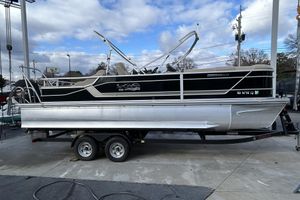 SunCatcher Fusion 324SS 2022 SunCatcher Fusion 324SS pontoon boat on trailer, parked outdoors.