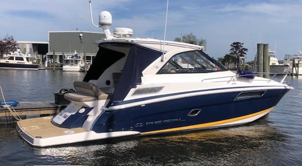 Regal 35 Sport Coupe 2014 Regal 35 Sport Coupe yacht docked at marina, featuring sleek design and modern amenities.