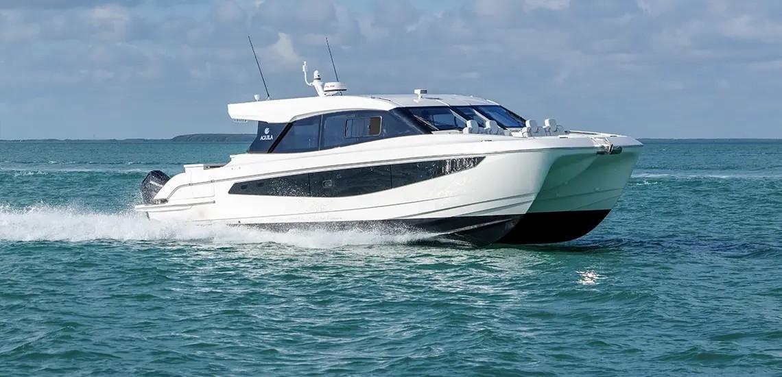 Aquila 42 Coupe Aquila 42 Coupe 2026 cruising on open water under a clear sky.