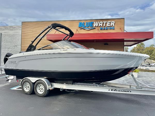 Cobalt R6 Outboard 2025 Cobalt R6 Outboard boat on trailer at Bluewater Marine dealership.