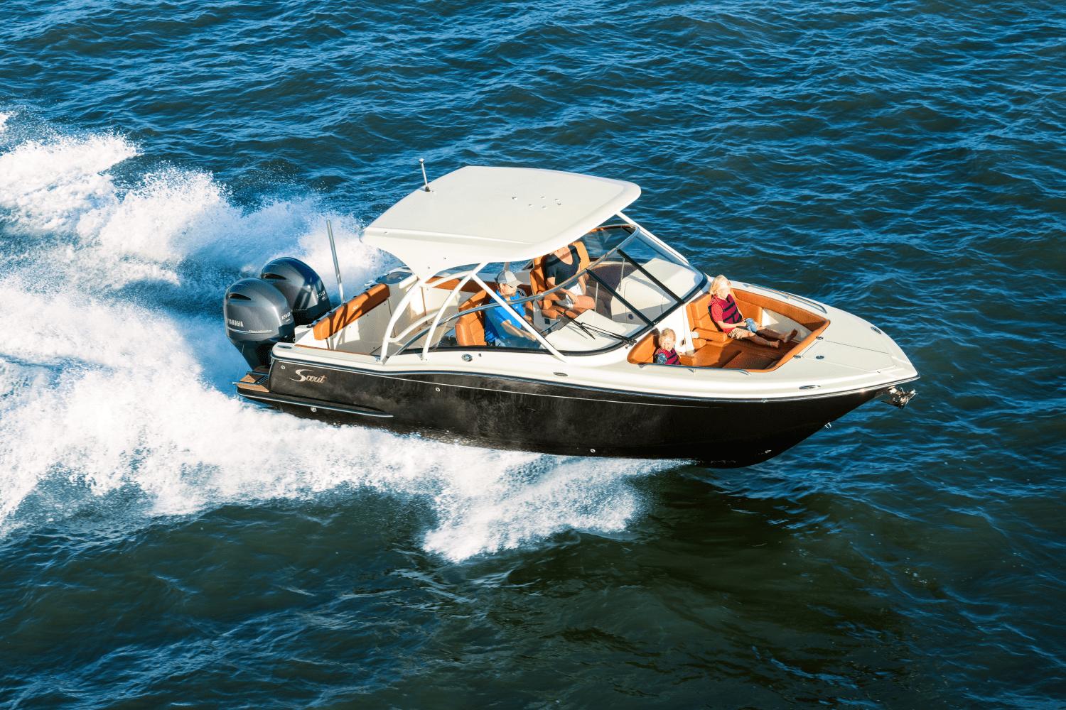 Scout 255 Dorado 2025 Scout 255 Dorado boat cruising on open water with passengers.