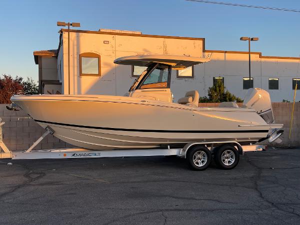 Chris-Craft Catalina 24 2024 Chris-Craft Catalina 24 boat on trailer, parked outdoors.