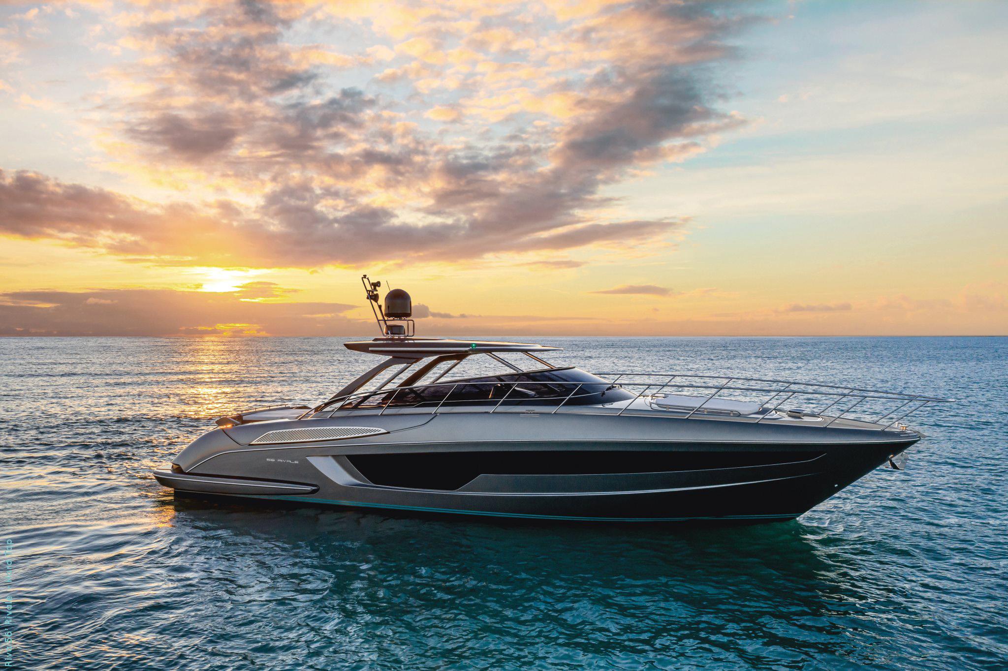 Riva 56' Rivale 2025 Riva 56' Rivale yacht cruising at sunset on tranquil ocean waters.