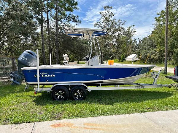 Sea Chaser 21LX 2022 Sea Chaser 21LX boat on trailer, parked outdoors.