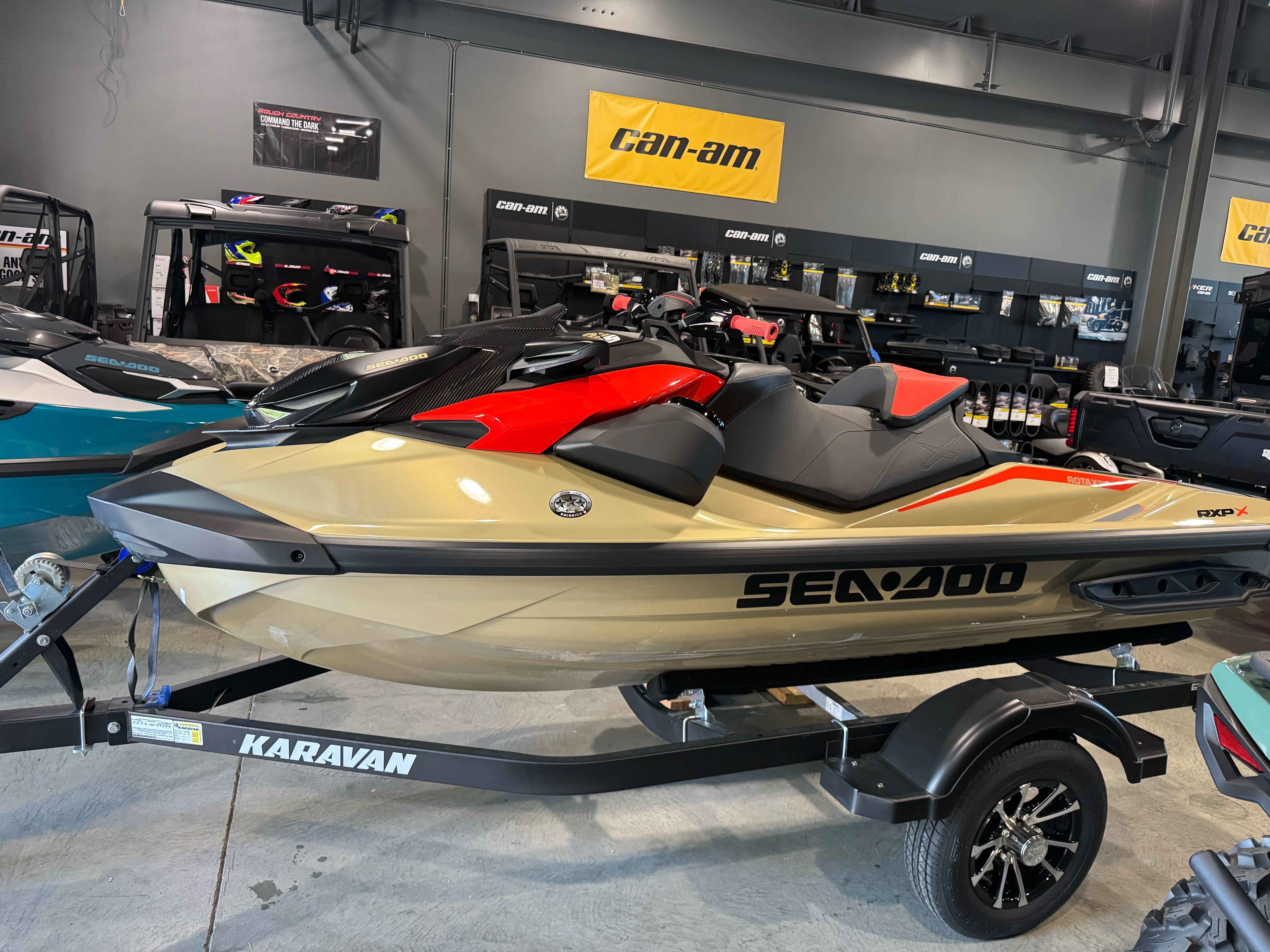 Sea-Doo RXP-X 325 2025 Sea-Doo RXP-X 325 jet ski on Karavan trailer in showroom.