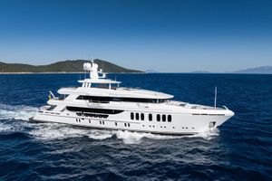 CMB Yachts CMB 47 Luxurious 2022 CMB Yachts CMB 47 cruising on open sea under clear blue sky.