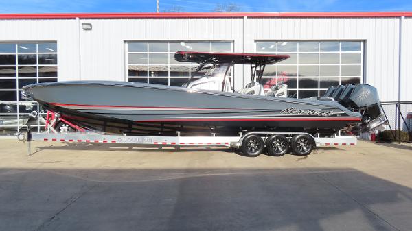 Nor-Tech 390 Sport Center Console 2024 Nor-Tech 390 Sport Center Console boat on trailer, parked outside a building.