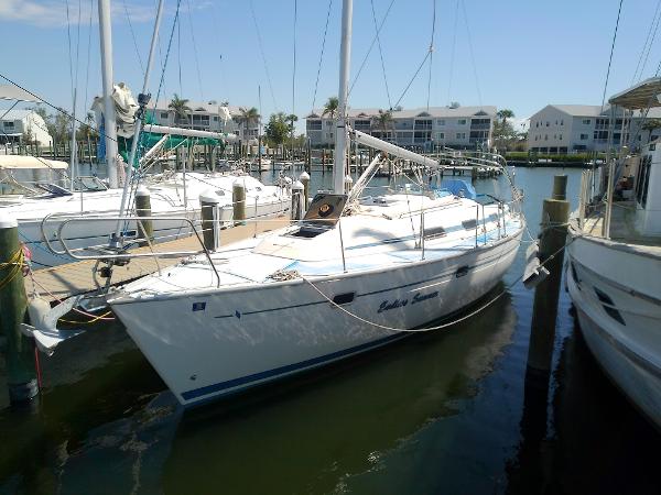 Bavaria 37 Cruiser 2001 Bavaria 37 Cruiser sailboat docked in a marina under clear skies.