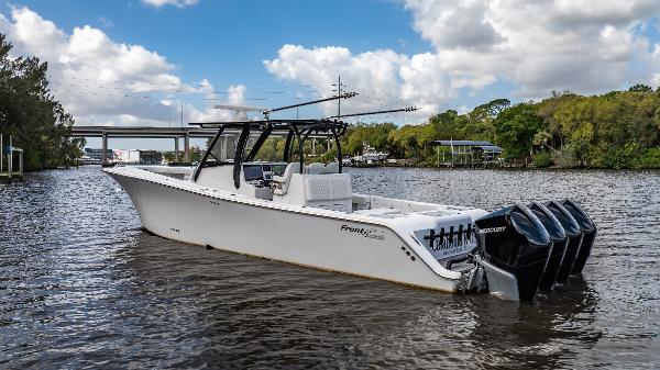 Front Runner 39 Center Console 2023 Front Runner 39 Center Console boat on a scenic river with four engines.