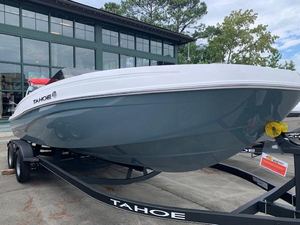 Tahoe T21 2024 Tahoe T21 boat on trailer outside showroom.