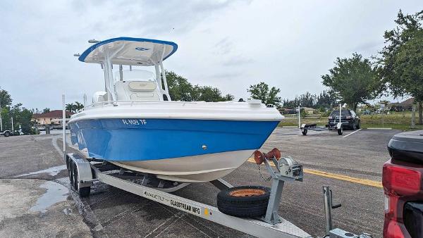 Glasstream 280 Pro-XS 2022 Glasstream 280 Pro-XS boat on trailer, blue and white design, parked outdoors.