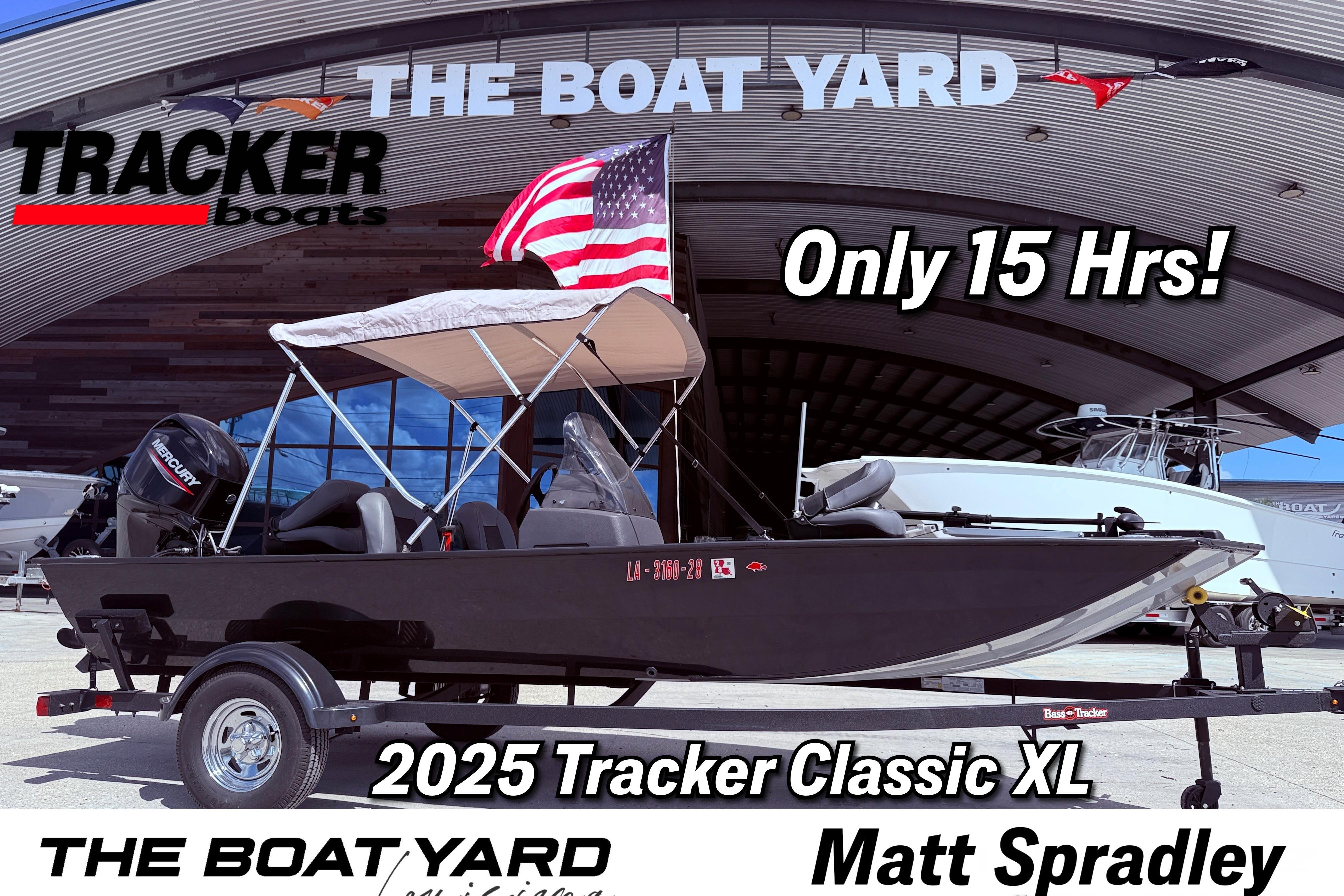 Bass Tracker Classic XL 2025 Bass Tracker Classic XL boat with canopy, American flag, and Mercury engine at The Boat Yard.