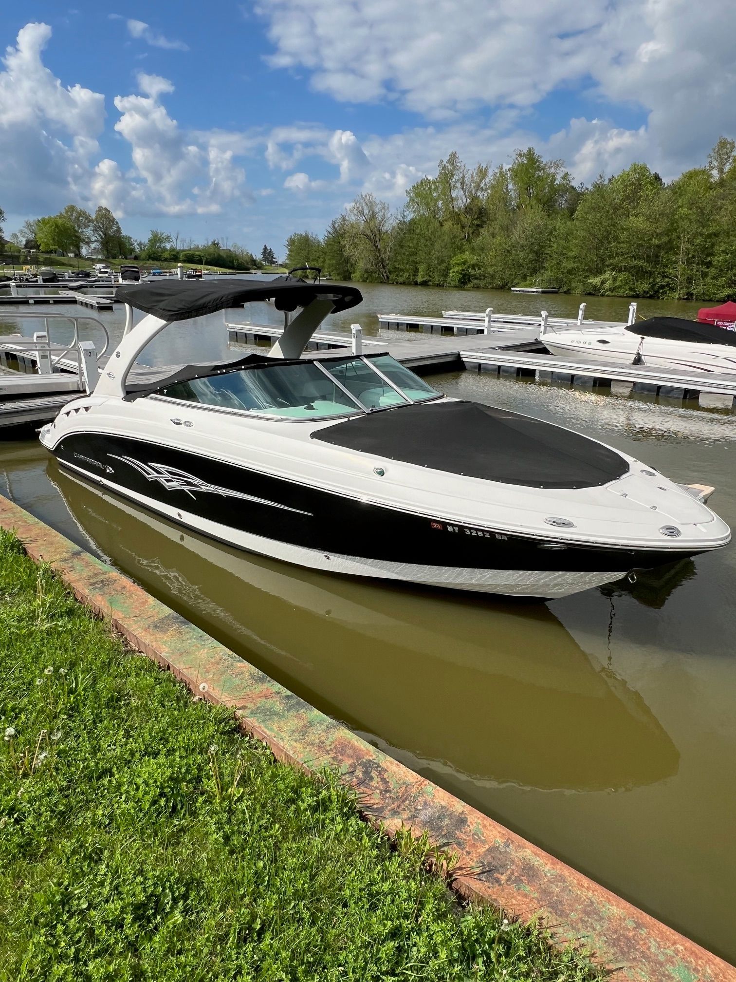 Chaparral SSX 276 2008 Chaparral SSX 276 boat docked on a calm lake under a partly cloudy sky.