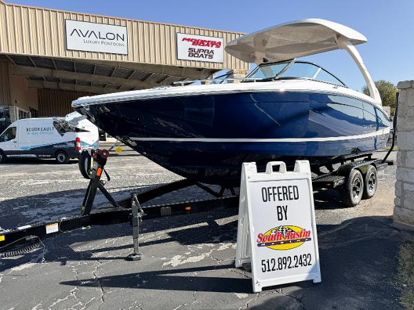 Regal LS6 2025 Regal LS6 boat on trailer at dealership, South Austin Marine sign visible.