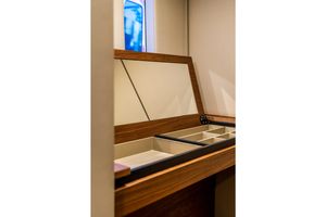 Sunreef Sunreef 50 Surf Soul Interior storage compartment on 2023 Sunreef 50 yacht, featuring elegant wood finish and organized sections.