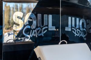 Sunreef Sunreef 50 Surf Soul "SOUL Surf" logo on 2023 Sunreef 50 yacht's sleek black surface.