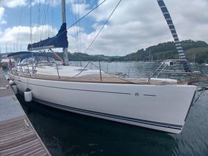 Dufour 455 Grand Large 2006 Dufour 455 Grand Large yacht docked at a marina, under a cloudy sky.