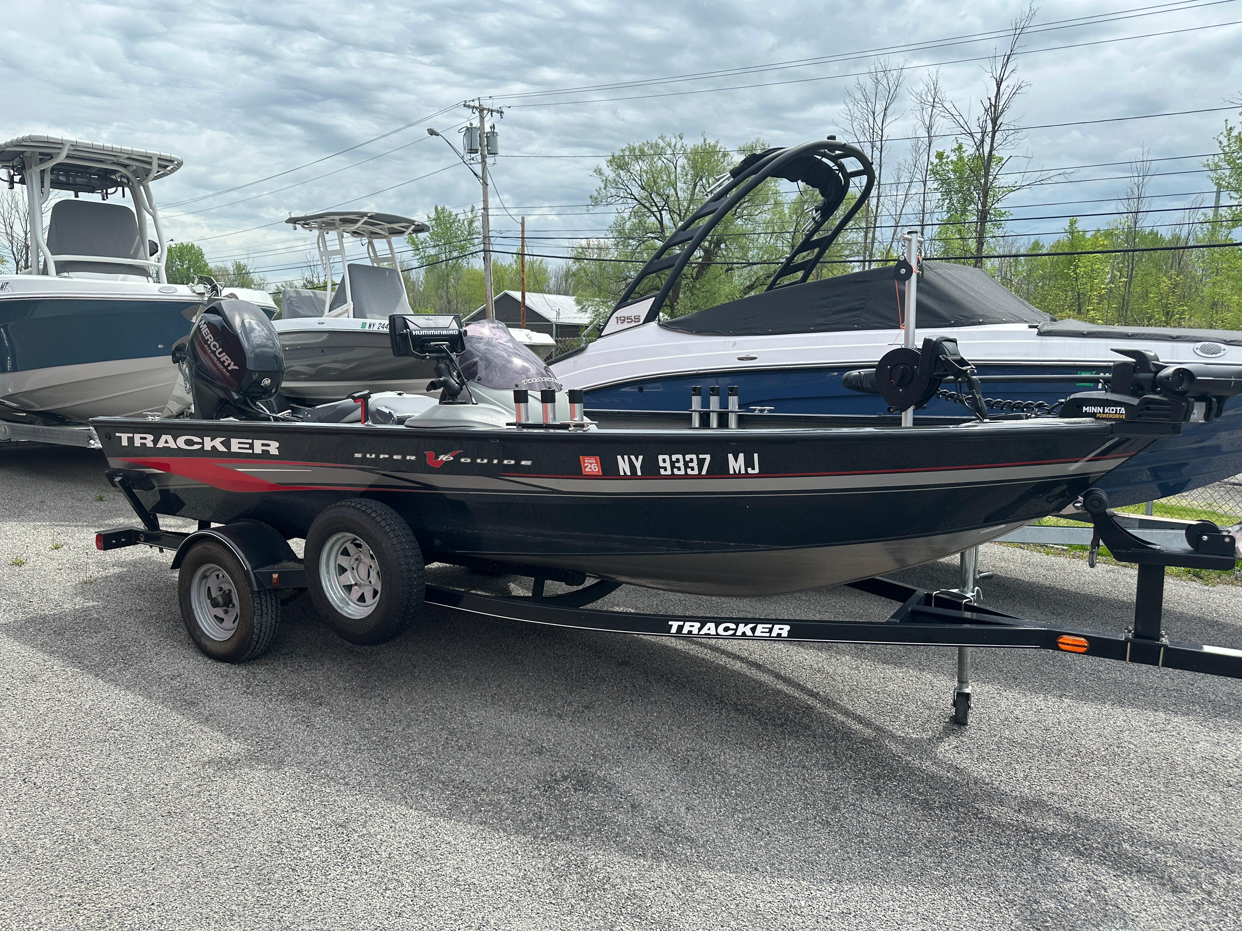Tracker Super Guide V-16 SC 2013 Tracker Super Guide V-16 SC boat on trailer, parked outdoors.