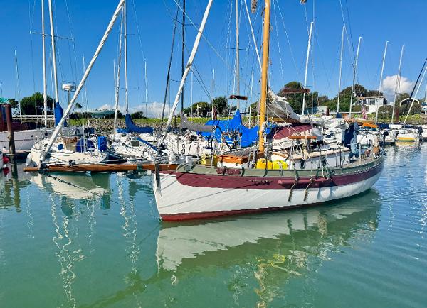 Bristol Channel Cutter 28 1982 Bristol Channel Cutter 28 sailboat docked in a sunny marina.