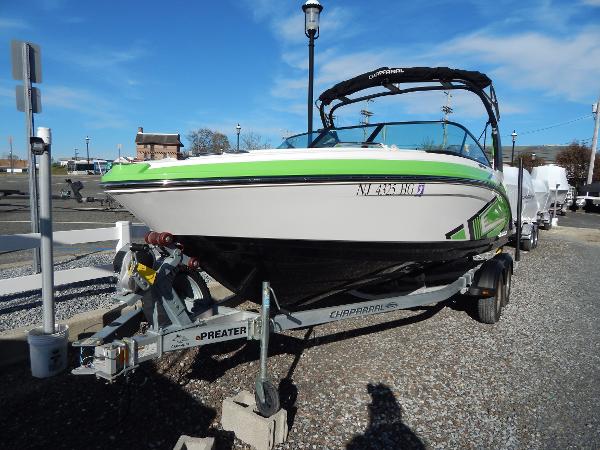 Chaparral Vortex 223 VRX 2015 Chaparral Vortex 223 VRX boat on a trailer in a marina.