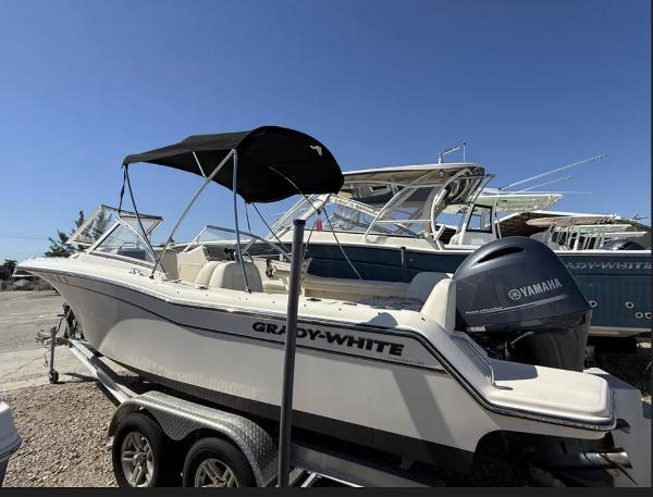 Grady-White Freedom 215 2020 Grady-White Freedom 215 boat with Yamaha engine on trailer, sunny day.