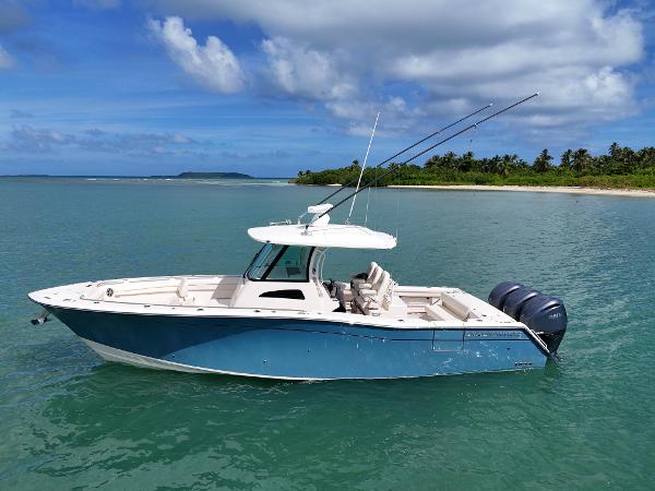Grady-White Canyon 336 2021 Grady-White Canyon 336 boat on turquoise water near tropical island.