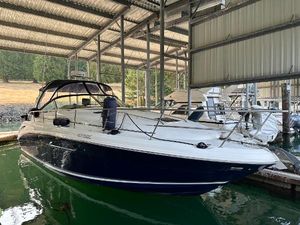Sea Ray 360 Sundancer 2004 Sea Ray 360 Sundancer docked in a covered marina, side view.