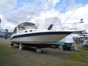 Sea Ray 290 Sundancer 1996 Sea Ray 290 Sundancer boat on blocks in a marina yard.