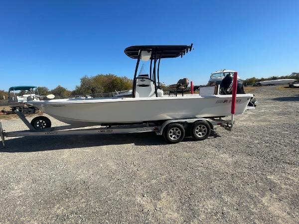 Sea Pro 248 Bay 2019 Sea Pro 248 Bay boat on trailer under clear blue sky.