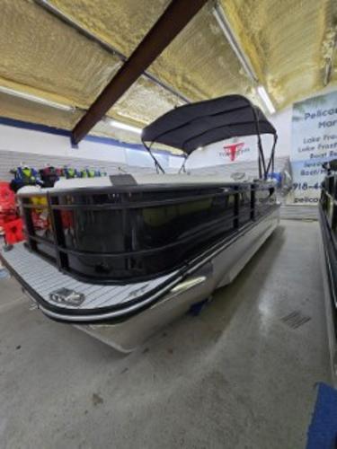 G3 322rc 2025 G3 322rc pontoon boat in showroom with canopy and modern design.