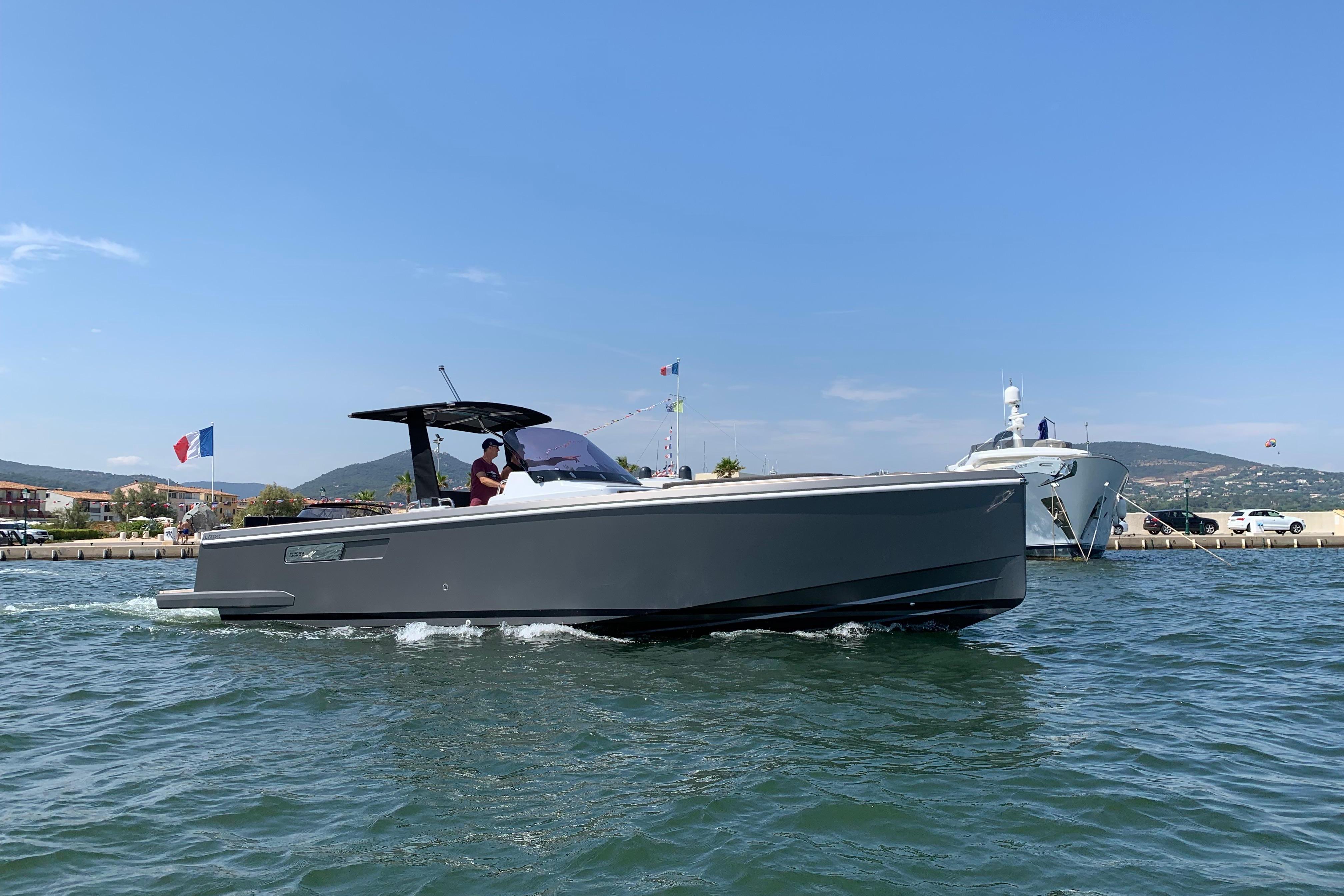 Fjord 36' Open 2019 Fjord 36' Open boat cruising on a sunny day near a marina.