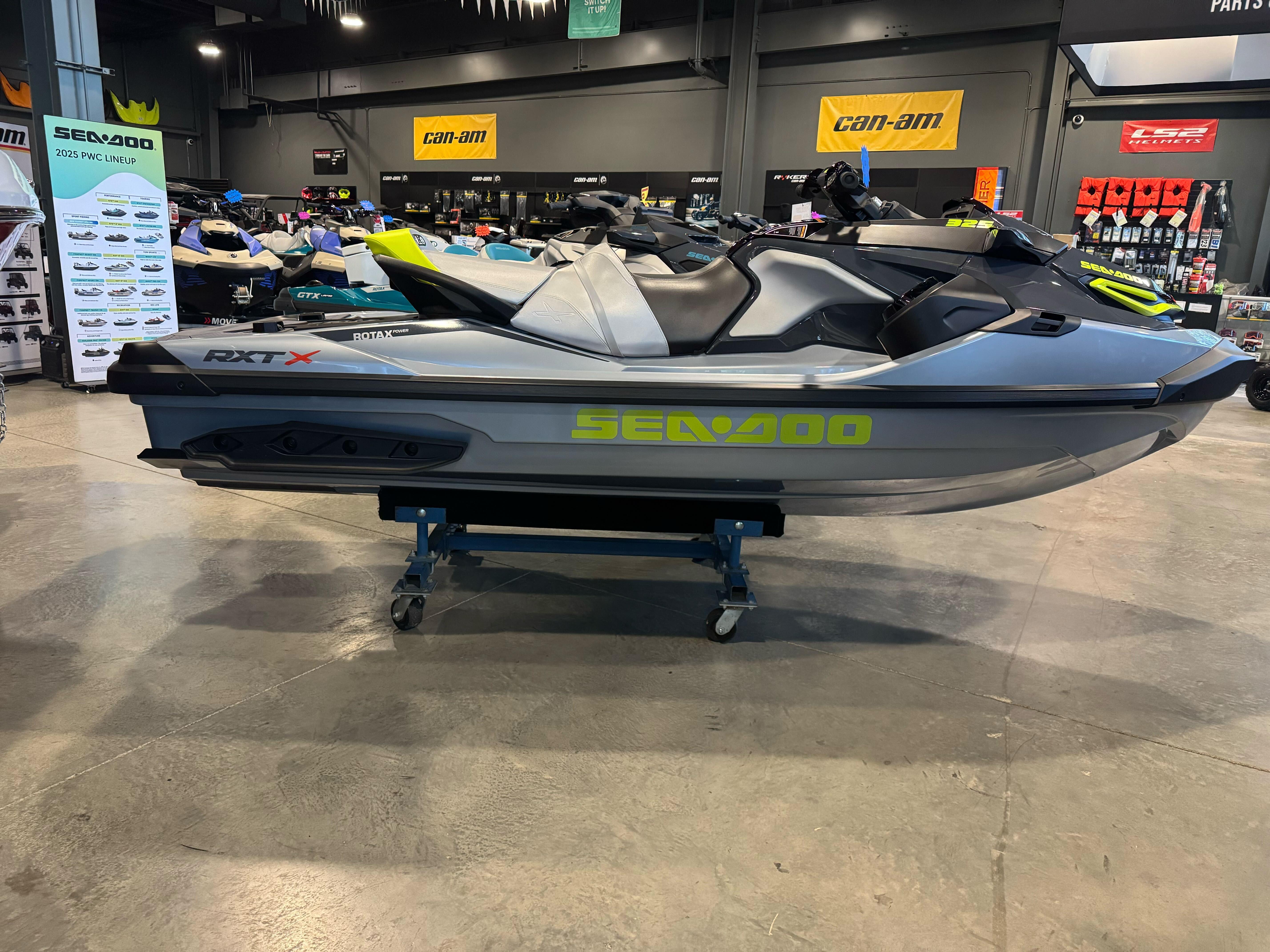 Sea-Doo RXT-X 325 2025 Sea-Doo RXT-X 325 jet ski displayed in showroom, featuring sleek design and modern features.
