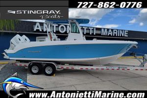 Stingray 253CC Center Console 2026 Stingray 253 CC boat on trailer at Antonietti Marine dealership.