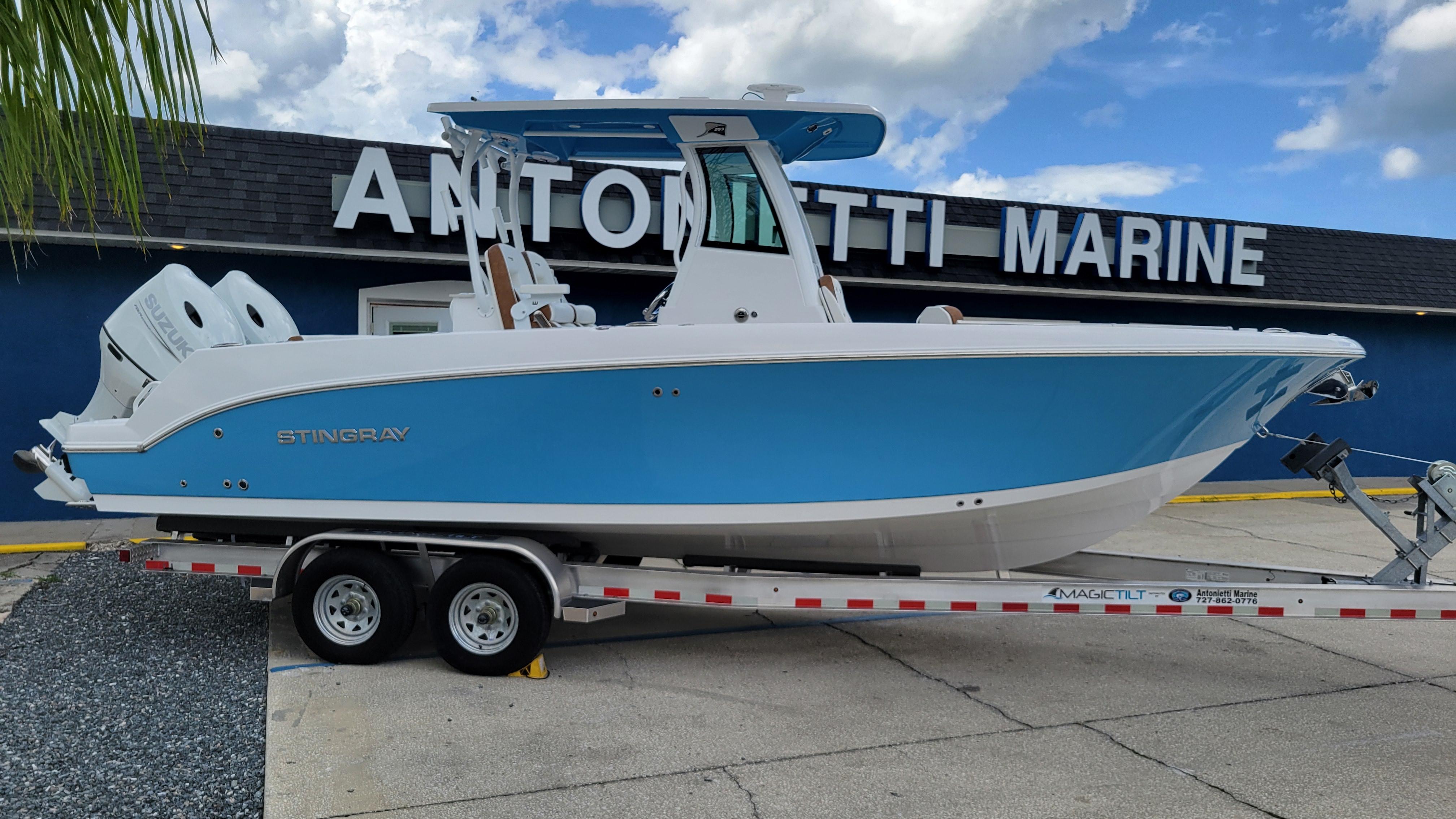 Stingray 253 CC 2026 Stingray 253 CC boat on trailer at Antonetti Marine dealership.
