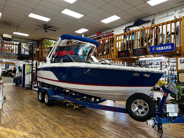 Cobalt CS23 Surf 2025 Cobalt CS23 Surf boat displayed indoors on a trailer.
