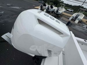 Blackfin 262 HB 2026 Blackfin 262 HB boat with powerful outboard engine, parked on wet pavement.