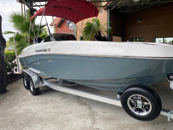 Tahoe T21 2024 Tahoe T21 boat with red canopy on trailer.