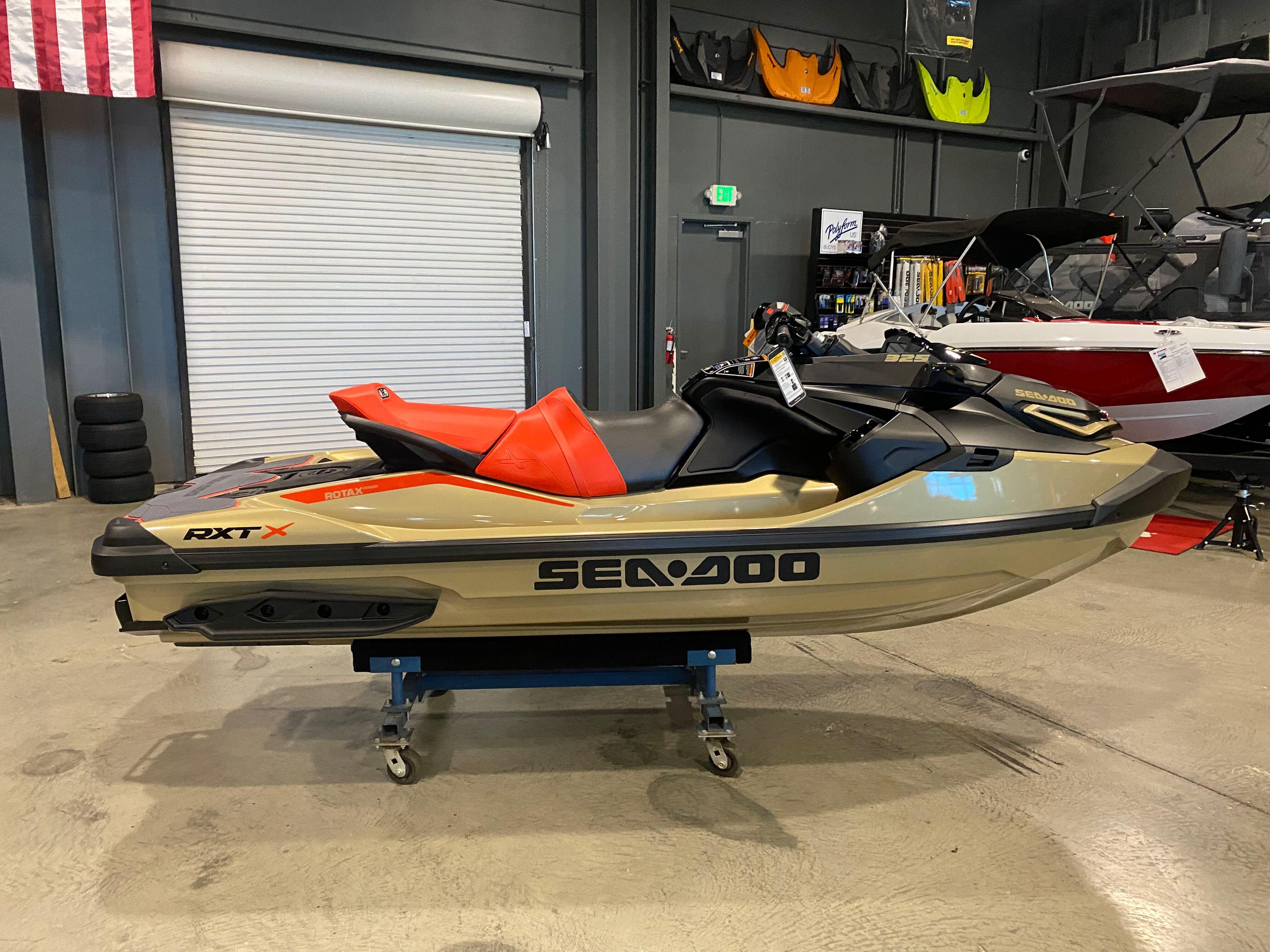 Sea-Doo RXT-X 325 2025 Sea-Doo RXT-X 325 jet ski in showroom, featuring sleek design and vibrant colors.