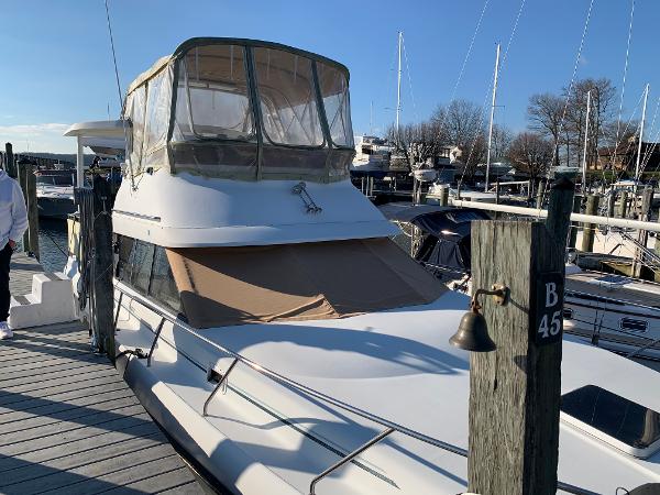 Silverton 34 Motor Yacht 1992 Silverton 34 Aft Cabin Motor Yacht docked at marina.