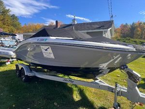 Sea Ray SPX 190 2023 Sea Ray SPX 190 boat on trailer, parked outdoors under clear sky.