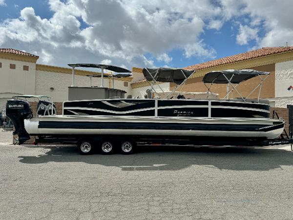 Premier Accolade 310 2019 Premier Accolade 310 pontoon boat with Suzuki engine on trailer.