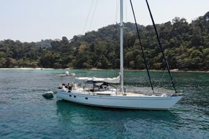 Ron Holland 52 Sailing yacht Ron Holland 52 (1981) anchored near lush tropical island.