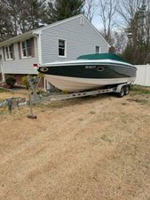 Cobalt 263 2006 Cobalt 263 boat on trailer in residential yard.