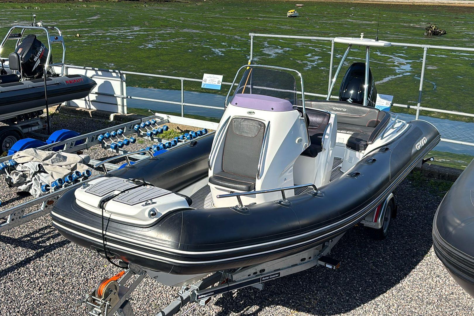 Grand Golden Line 650 2021 Grand Golden Line 650 inflatable boat on trailer by the water.