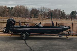 Ranger RT188 2026 Ranger RT188 boat on trailer, parked outdoors with trees in background.