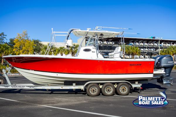 Regulator 28 2011 Regulator 28 boat with red hull on trailer at Palmetto Boat Sales.