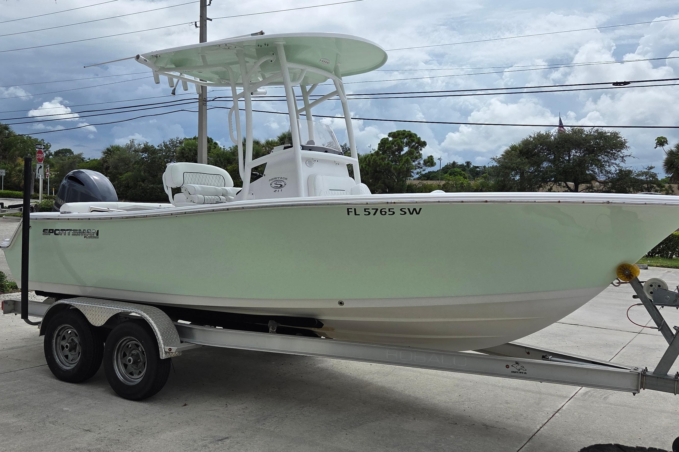 Sportsman Heritage 211 Center Console 2021 Sportsman Heritage 211 Center Console boat on trailer, parked outdoors.
